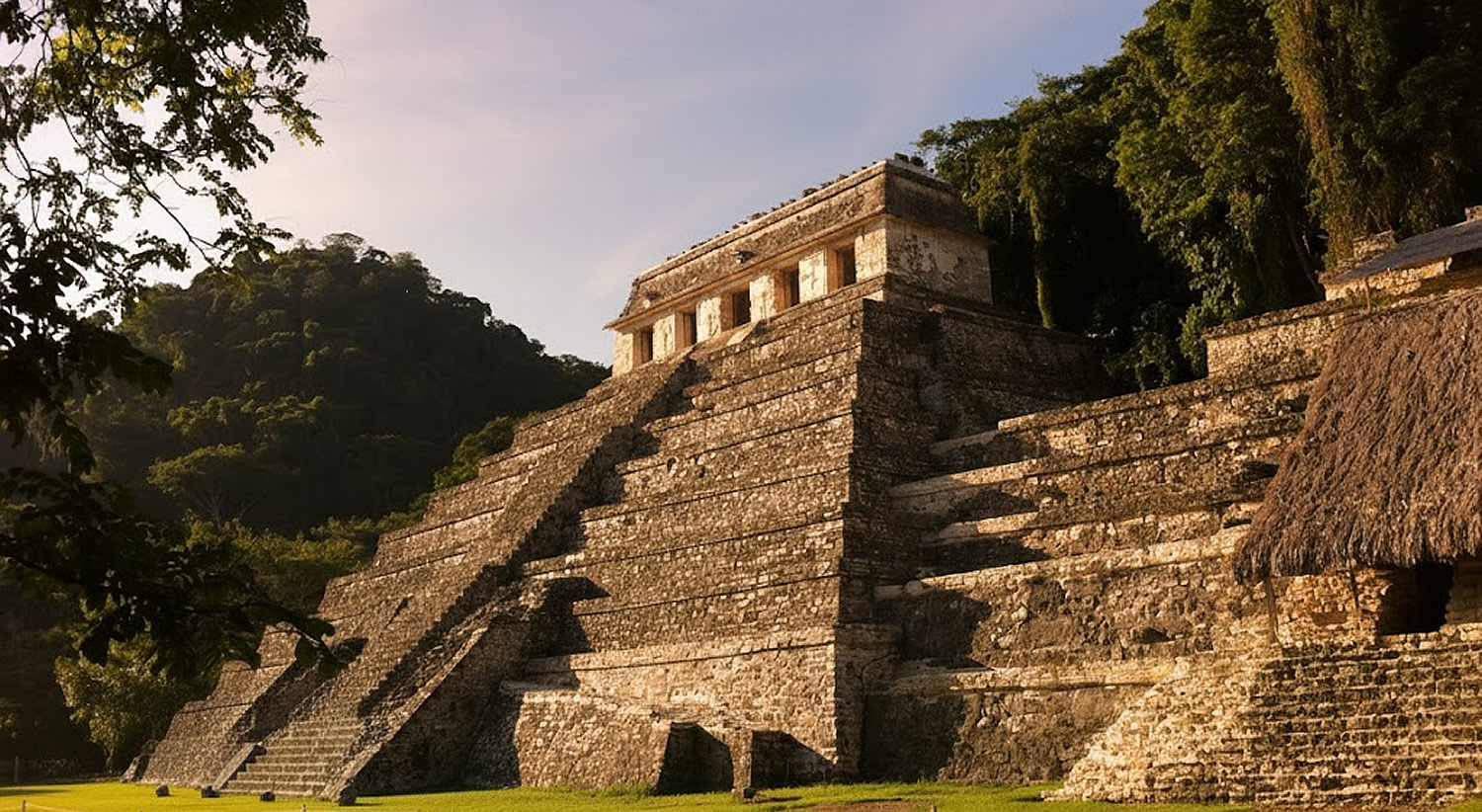 Lush jungle ruins of Palenque archaeological site in Chiapas, Mexico, surrounded by misty highlands and waterfalls.