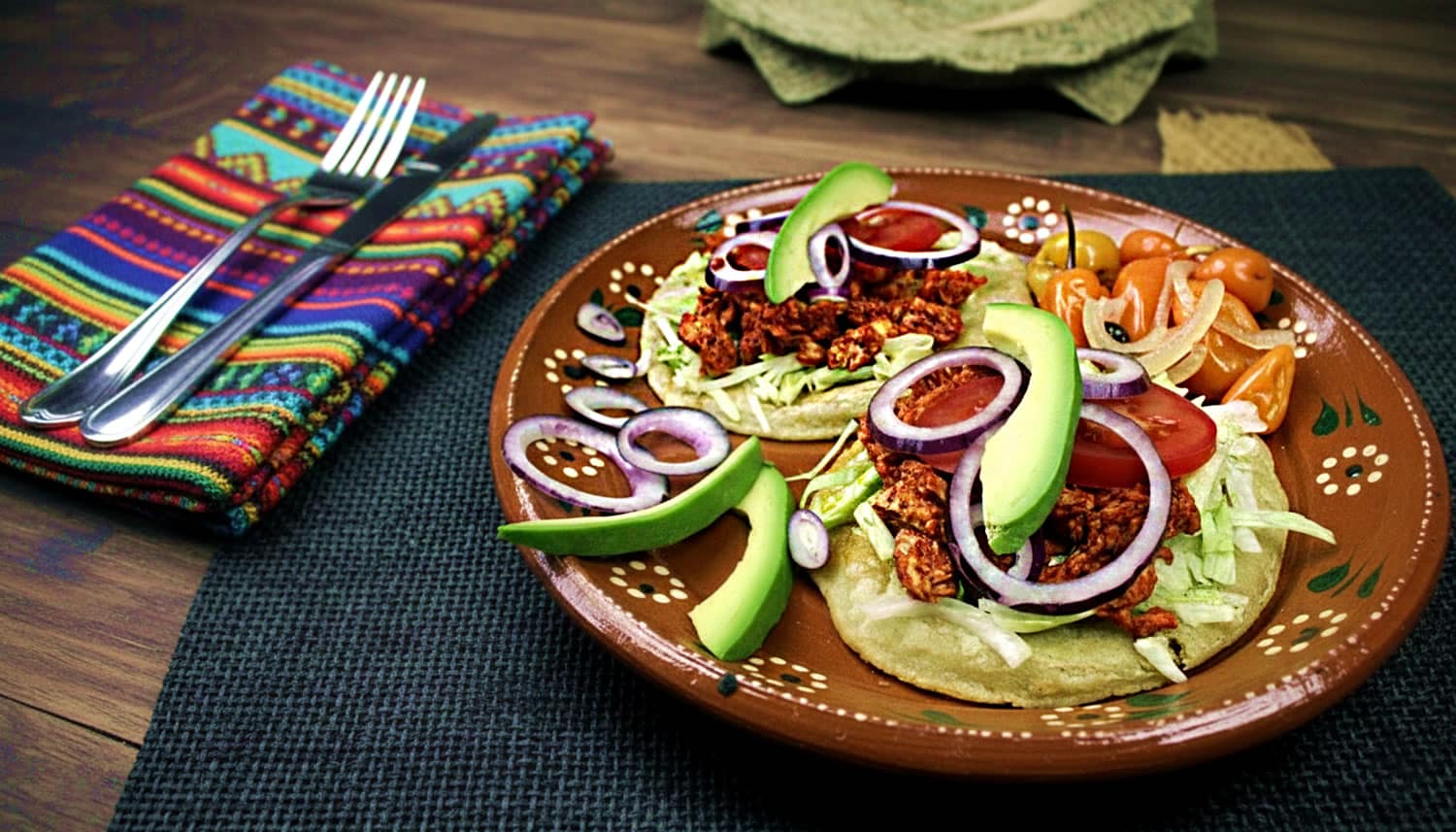 A street food stand in Mérida with tortillas, salsas, and local Yucatecan toppings ready to serve
